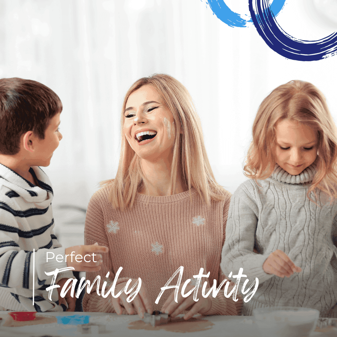 Happy family woman and two kids baking cookies together in cozy sweaters