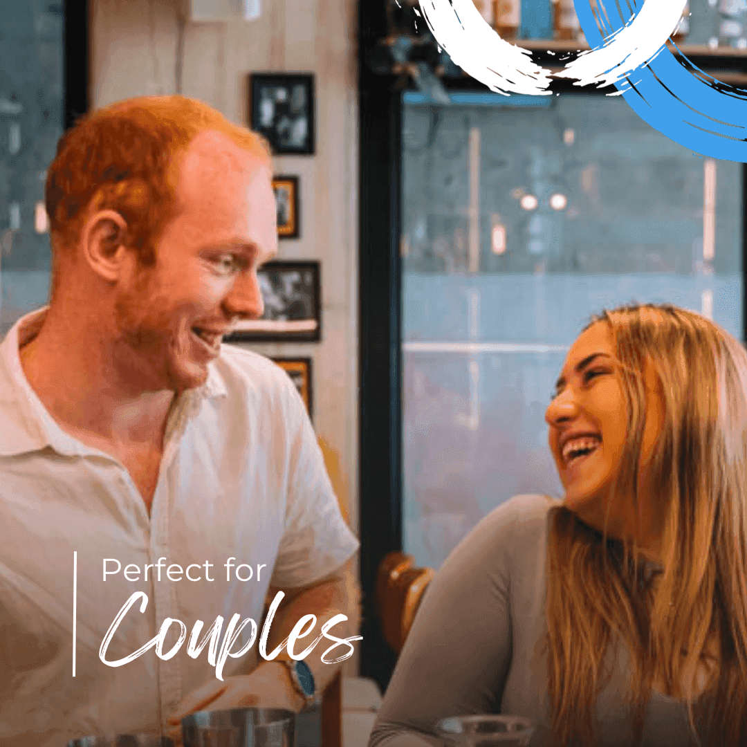 Smiling couple enjoying coffee together in cozy cafe setting with text Perfect for Couples