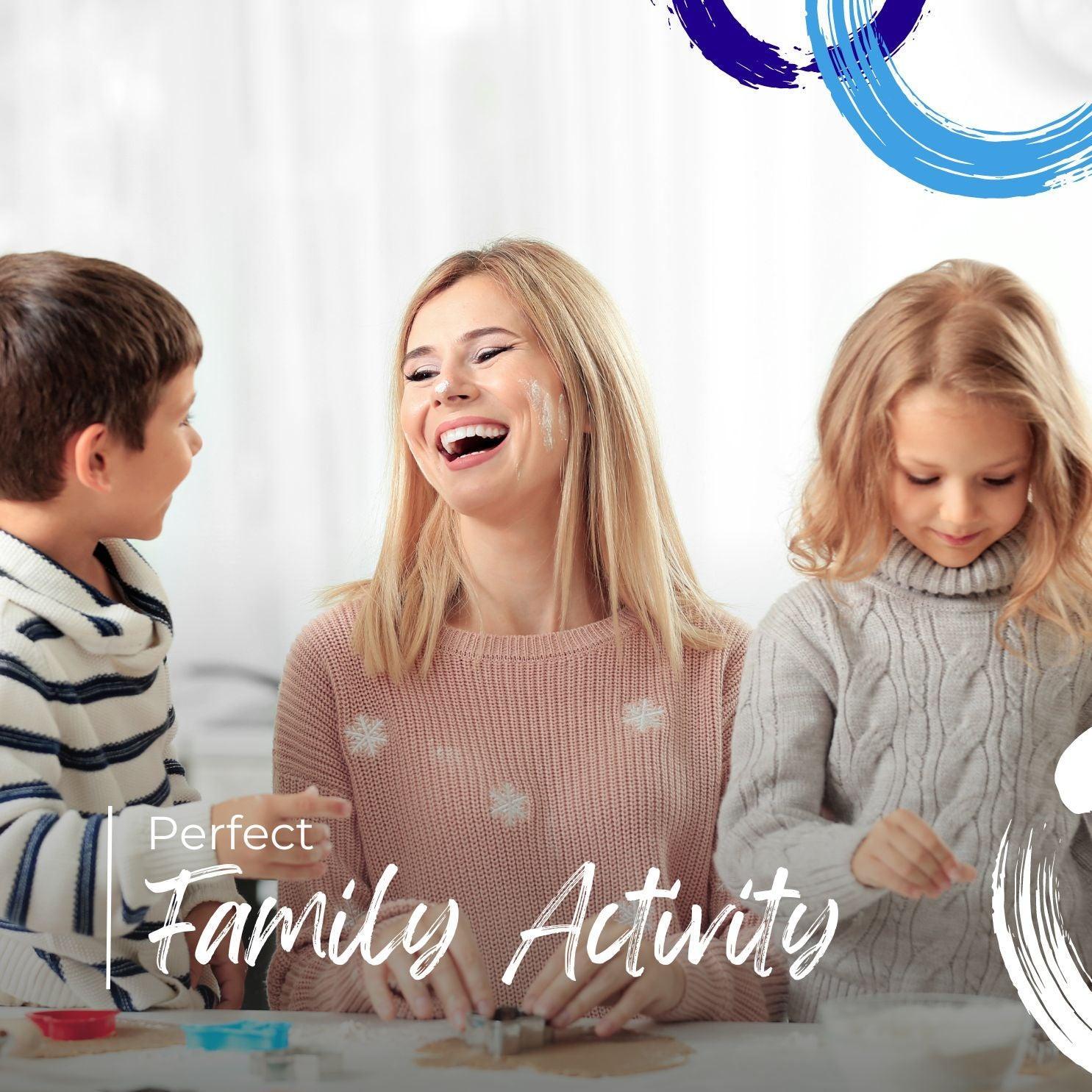 Happy mother and two children baking cookies indoors, enjoying family activity together