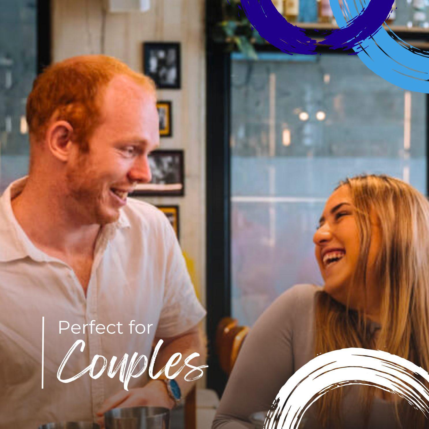 Happy couple smiling and enjoying coffee together in cozy cafe setting