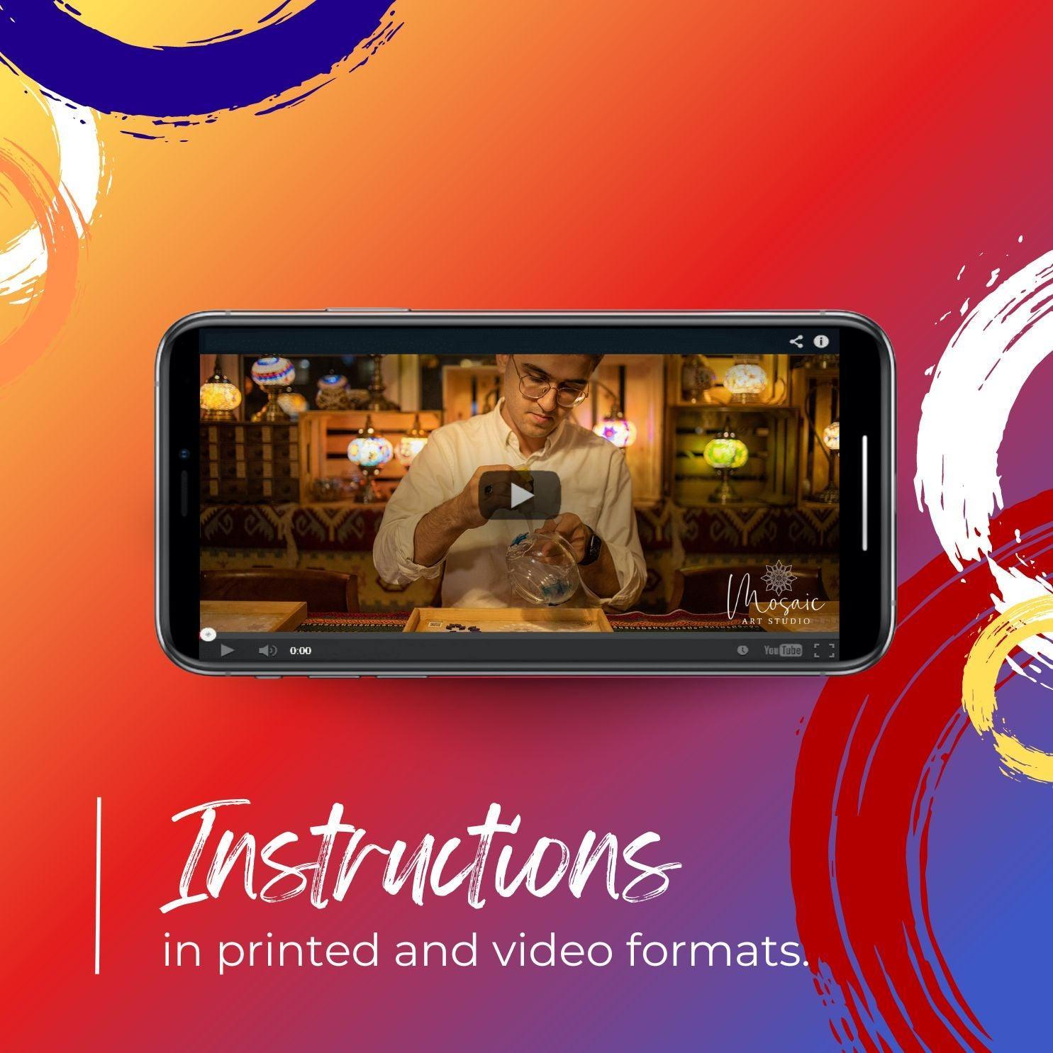 Smartphone showing mosaic candle holder DIY video tutorial in cozy studio with colorful mosaic lamps