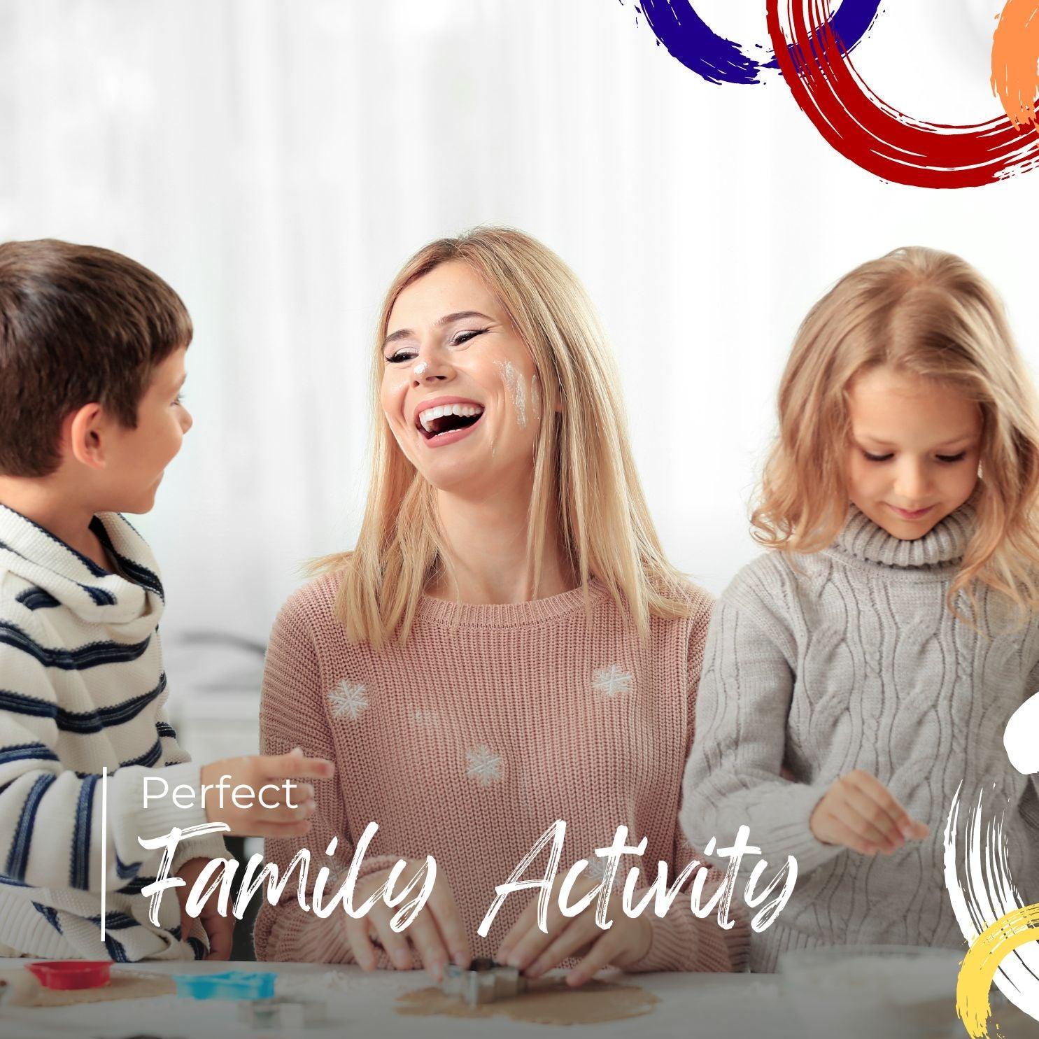 Mother and children enjoying fun family baking activity with cookie cutters and dough