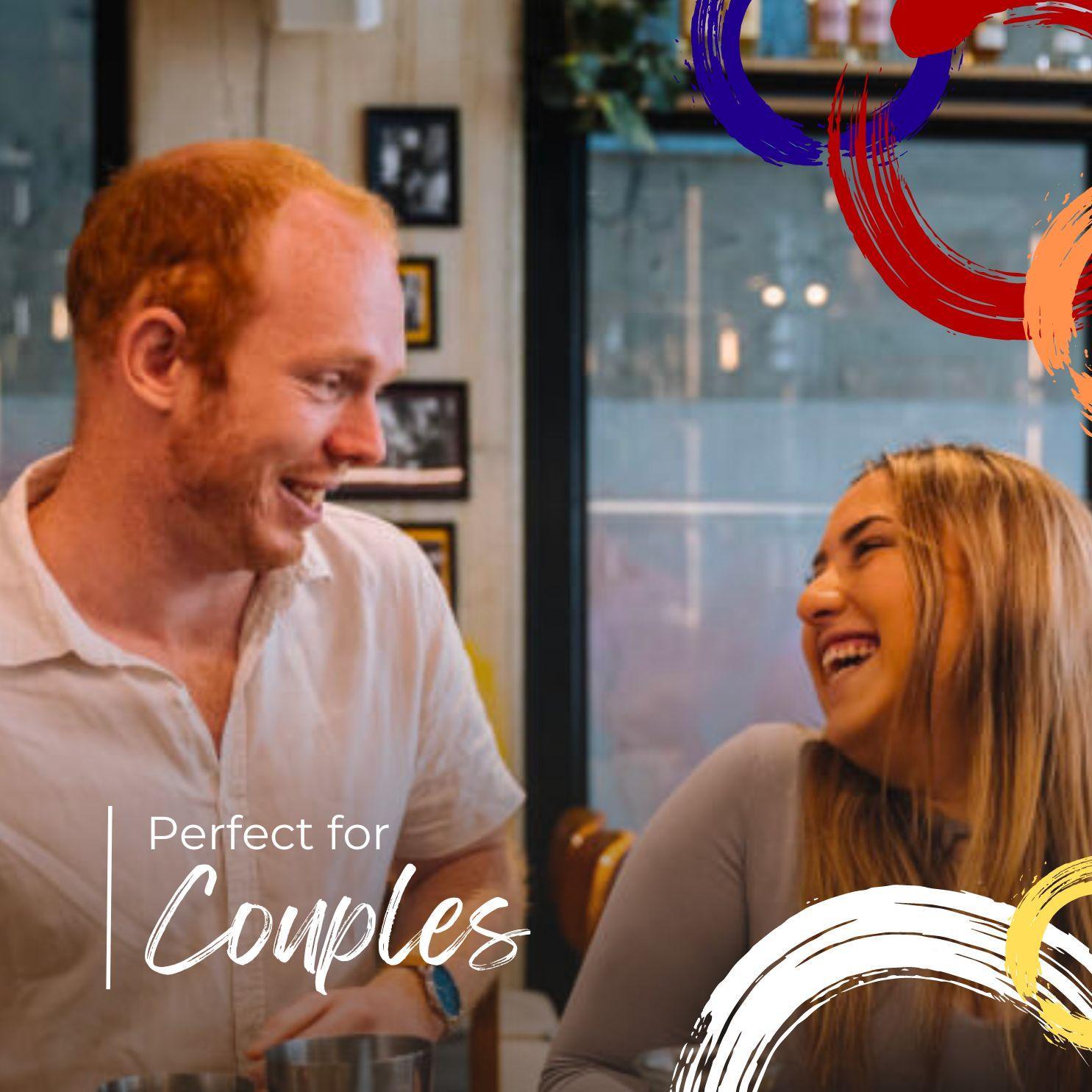 Smiling couple enjoying coffee date in cozy cafe with colorful brush stroke accents